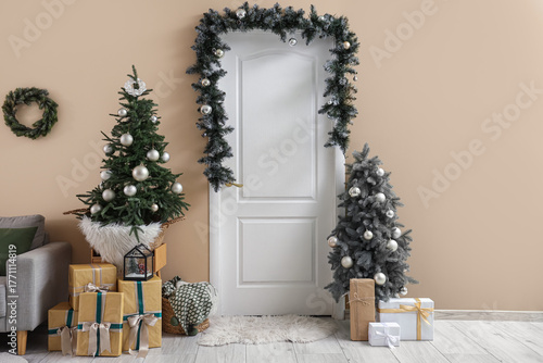 White door with fir branch,...