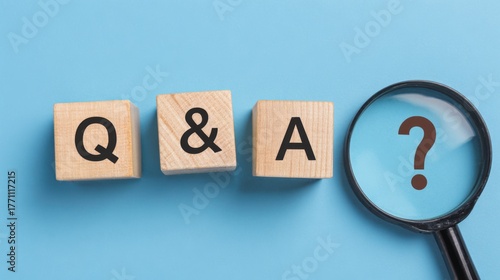 Question and Answer Analysis: A close-up shot focuses on Q&A letters on wooden blocks, juxtaposed with a magnifying glass hovering over a question mark, stimulating inquiry and communication. 