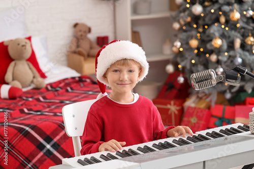 Cute little boy in Santa ha...