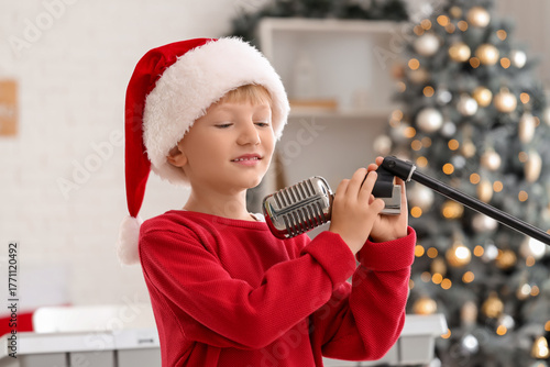 Cute little boy in Santa ha...