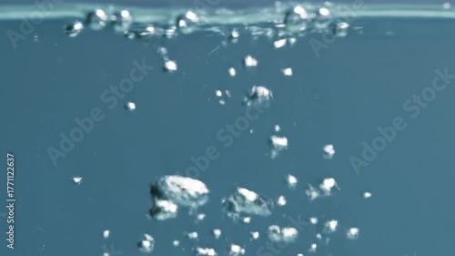 Wallpaper Mural Luminous tiny bubbles slowly rising and elegantly bursting on the surface of clear, pristine water transparent, slowly rising, purity Torontodigital.ca