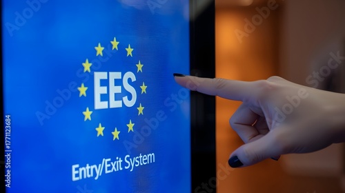 Modern EU Entry Exit System touchscreen kiosk being operated by a traveler, showing digital border control technology and biometric registration interface