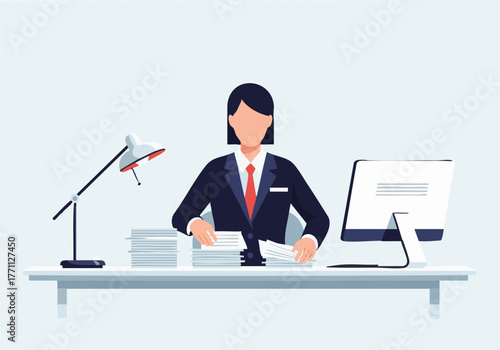 A woman in a suit works at a desk with a computer, lamp, and stacks of papers, seemingly organizing documents.