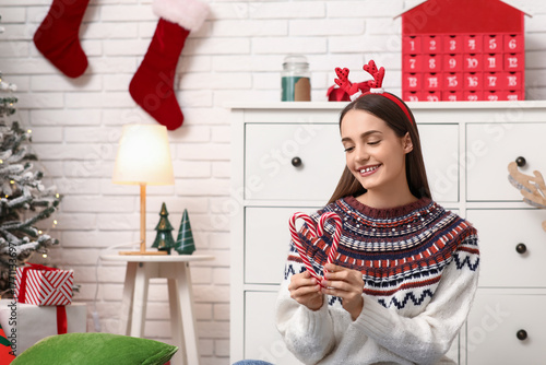 Young woman in sweater with...