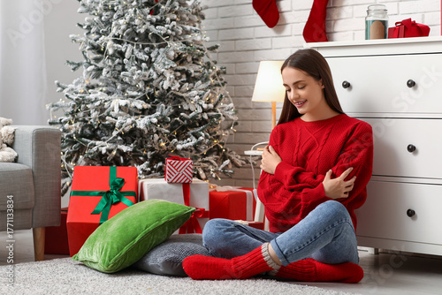Young woman in warm sweater...