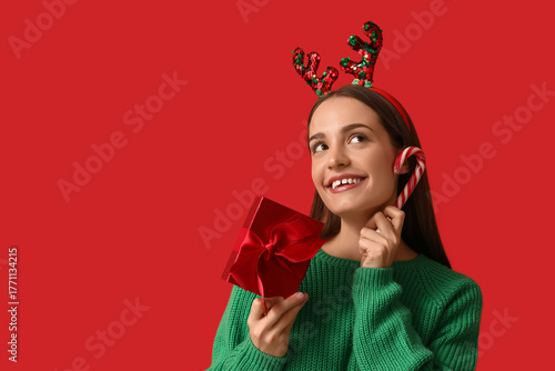 Young woman in reindeer hor...