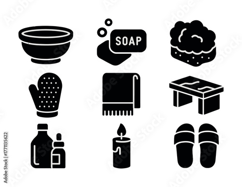 Black and white icons of bath accessories including soap, towel, candle, and slippers