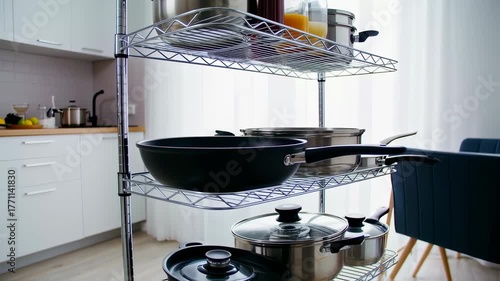 Organized Kitchen: Stainless Steel Pots and Pans Storage on Shelving Unit