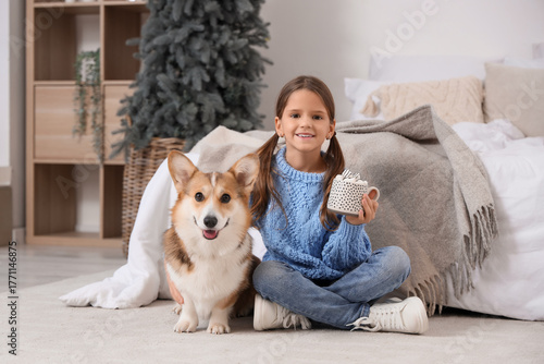 Cute smiling girl with Corg...