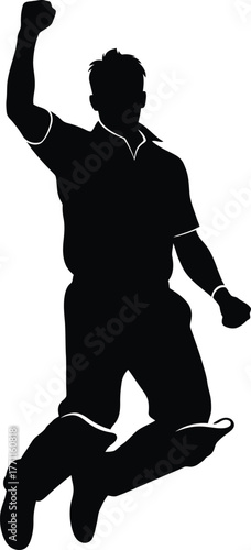 Silhouette of a triumphant athlete celebrating a victory with a raised fist