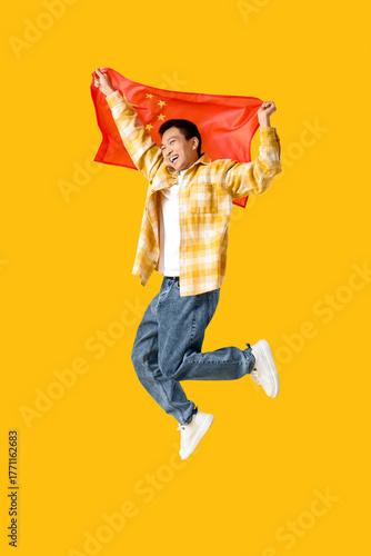 Young Asian man with flag o...