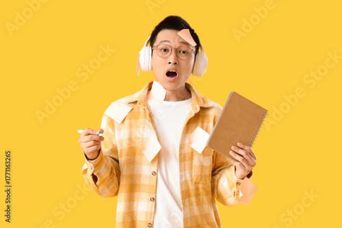 Surprised young Asian man w...