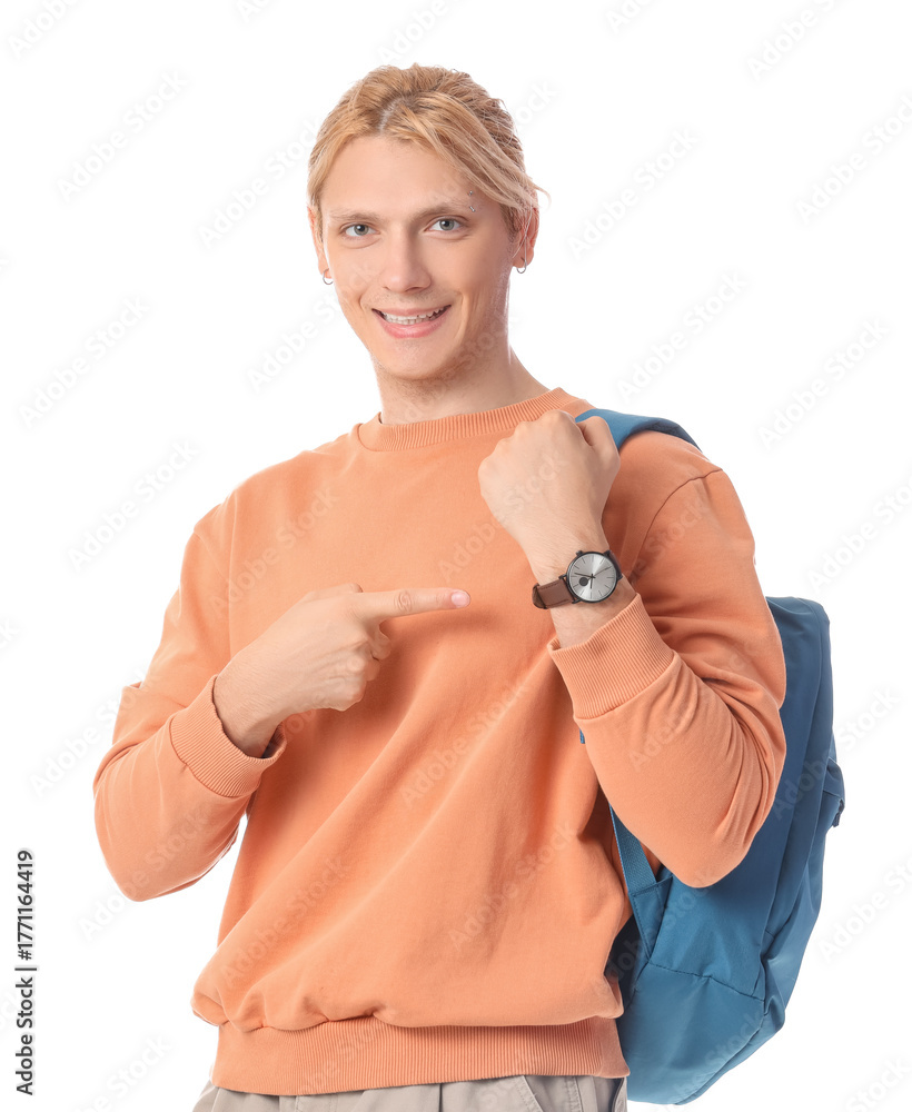 Fototapeta premium Male student pointing at wristwatch on white background. Time management concept