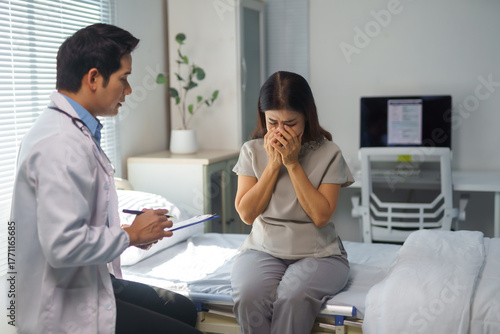 Принти на полотні Doctor conversing with an emotional patient receiving difficult news during a me