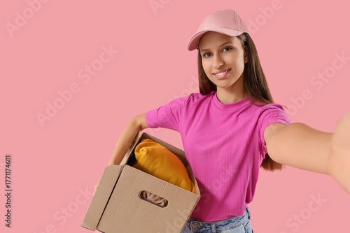 Young woman with cardboard ...