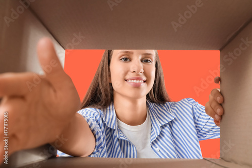 Young woman with open cardb...