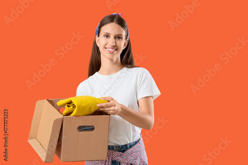 Young woman taking clothes ...