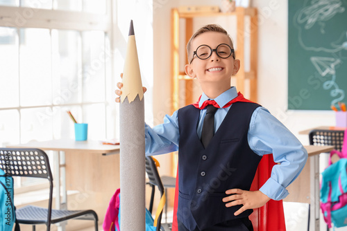 Cute little schoolboy with ...