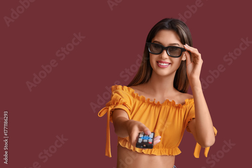 Young woman in 3D glasses w...