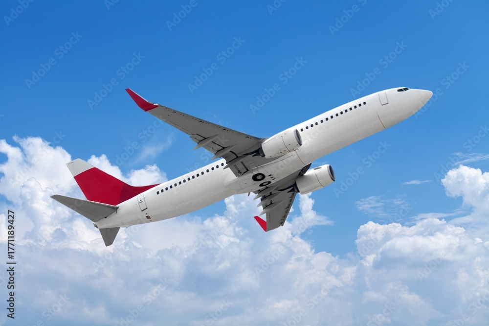 Obraz premium Airplane flying in blue sky with clouds, travel background