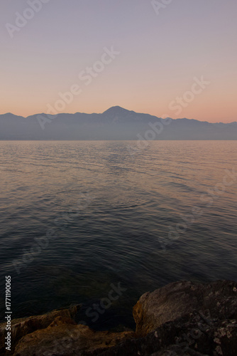 sunset over a lake with mountains