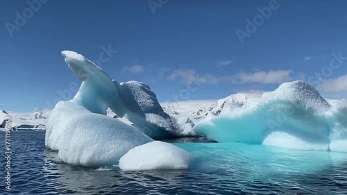 Antarctica's cold blue iceberg floats in the sea near Iceland's Jökulsárlón glacier lagoon landscape
