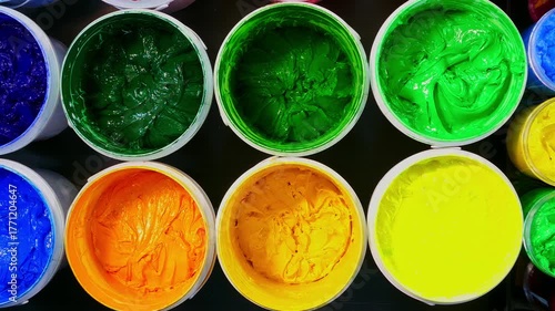 top view of Industrial Plastisol Ink for Fabric Printing
Plastisol ink is an essential raw material in the Tee shirt printing industry stored in barrels and containers across factories and stores.