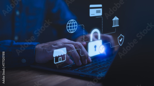 Person using a laptop computer with glowing lock and fintech icons, symbolizing cybersecurity, online banking protection, secure payment, data privacy, financial safety, and internet security concept.
