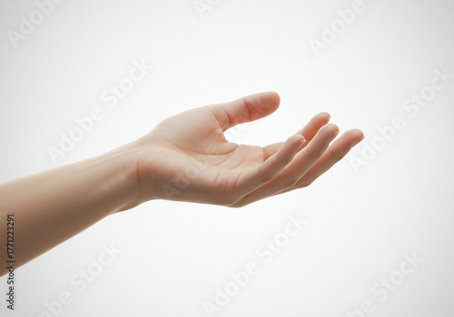 A close-up shot of a Caucasian hand with an open palm facing upwards against a plain white background.