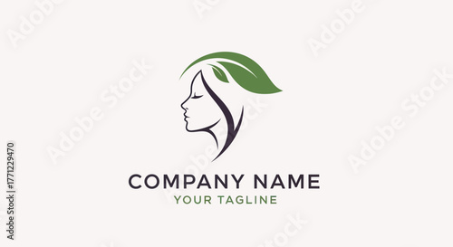 Natural beauty logo with a womans face in profile and a green leaf in her hair.