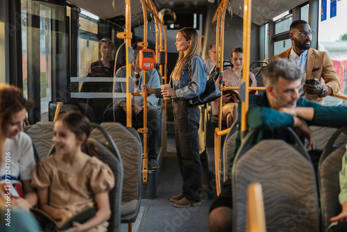 Photos Diverse people commuting on a public transportation bus