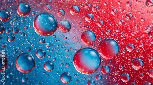 A stunning macro shot of water droplets with captivating red and blue hues