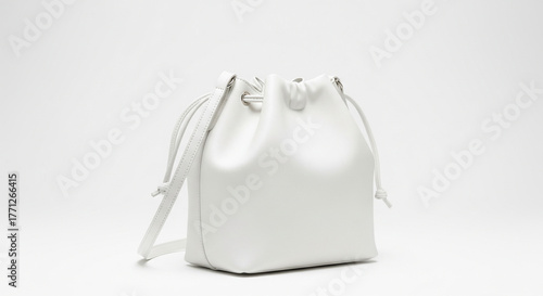 Minimalist White Leather Drawstring Bucket Bag on Simple White Background