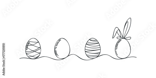 Four decorative Easter eggs arranged in a line on a wavy surface with bunny ears on one egg