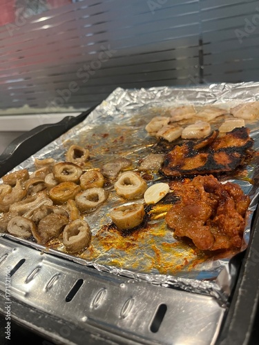 Sizzling korean bbq Intestines and meats on foil