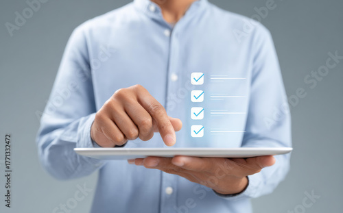 Focused businessman using tablet for data driven hr management and workforce planning. concept of efficient digital checklist and modern technology for successful project management