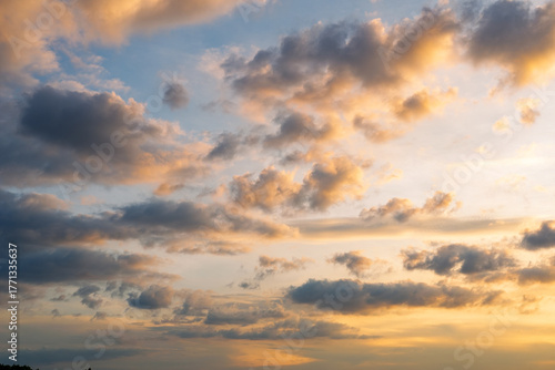 Sunset sky clouds in the Evening with Golden orange sunlight in golden hour, Dusk sky background