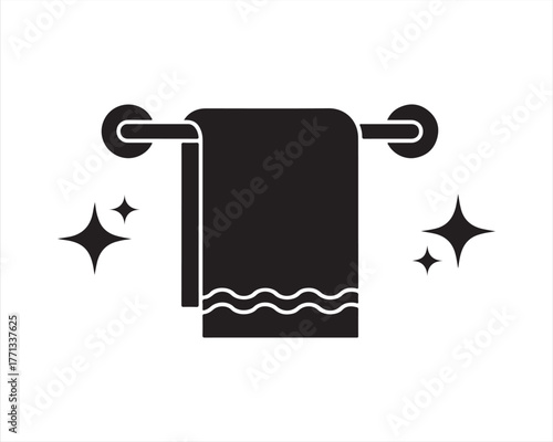 Clean black towel hanging on a rack with sparkling stars