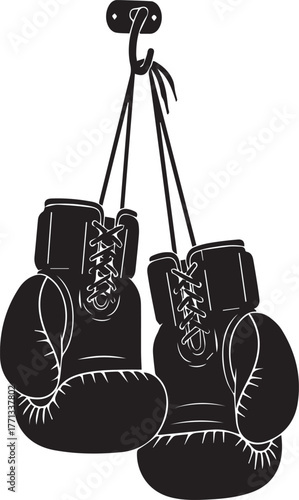 Iconic pair of black boxing gloves hanging together by laces ready for a fight