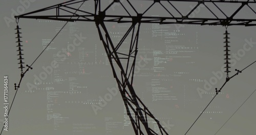 Standing steel lattice high-voltage tower holding power lines in corridor, with ceramic insulators