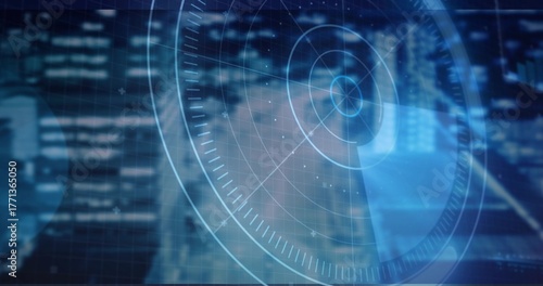 Displaying translucent circular radar interface overlaying nighttime city skyline, with data nodes
