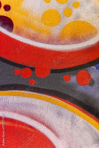 beautiful wallpaper of street wall graffiti painting of aerosol urban art. Colorful city background of spray graffiti drawing in modern culture style