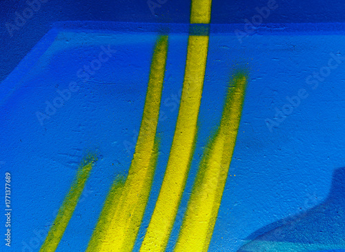 Beautiful colorful street art graffiti background. The wall is decorated with abstract drawings house paint. Modern style urban culture of street youth. Abstract picture on wall