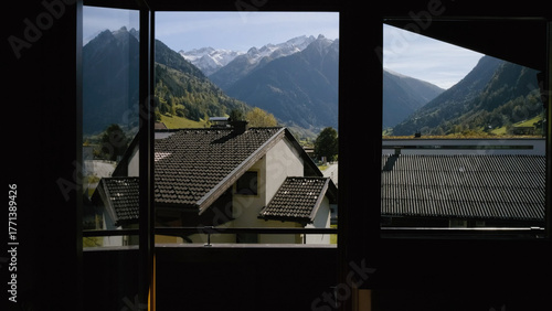 Mountain view from a cozy window overlooking Grossglockner during a bright sunny day
