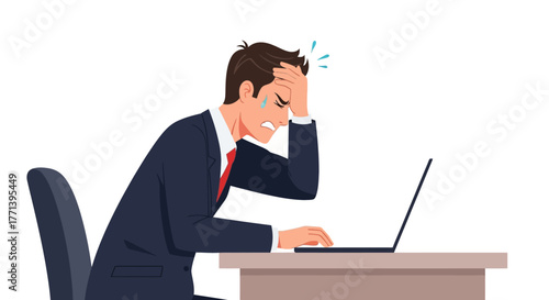 Stressed businessman at office desk holding his head in frustration, overworked with a computer problem or deadline pressure