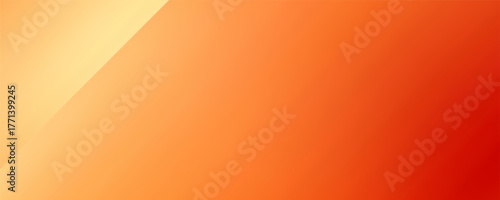 Warm orange yellow red gradient background. Autumn colored blurred wallpaper.