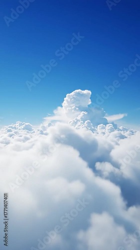 A vast expanse of bright blue sky with a sea of fluffy white clouds
