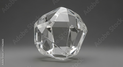 A clear crystal gemstone with many facets on dark gray background
