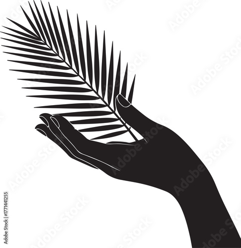 Hand holding palm frond leaf black