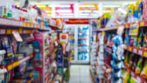 Fotografía Defocused photo of A minimarket store aisle with a variety of products on the shelves
